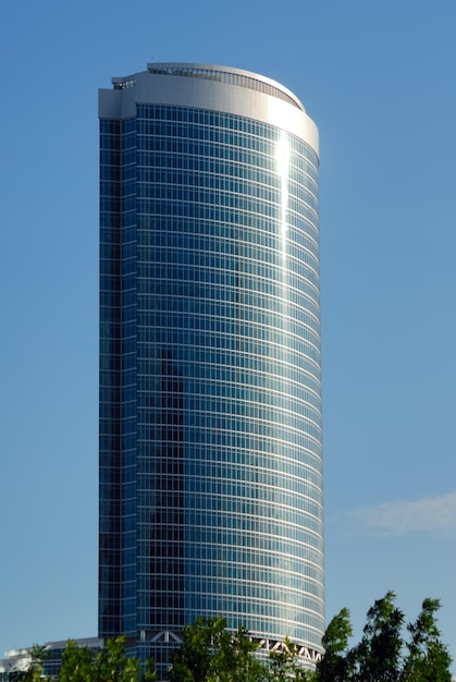 Skyscraper. Modern high-altitude office building from steel, glasses and concrete.