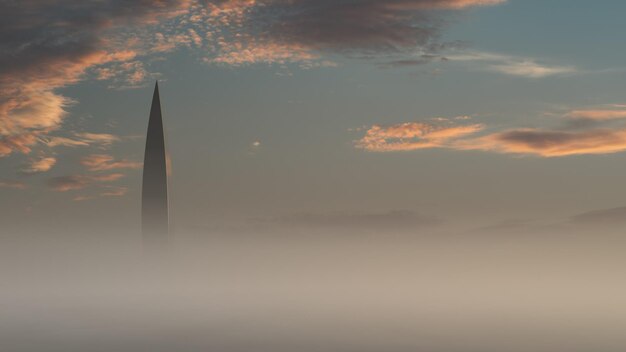 Photo the skyscraper tower sticks out of the thick fog. aerial view on a foggy morning