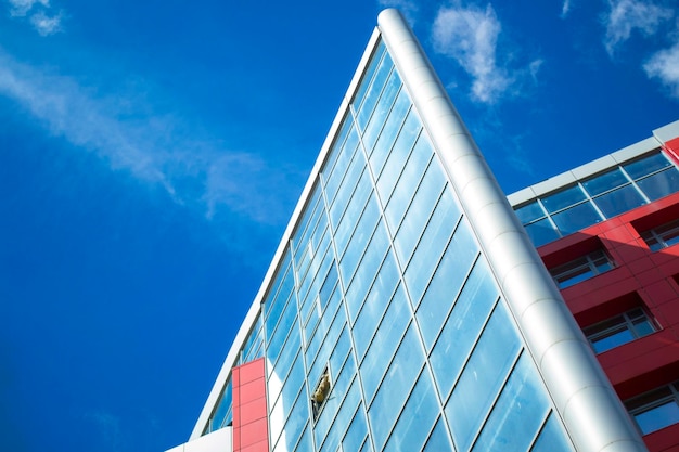 Skyscraper with mirrored windows and clear blue sky