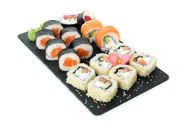 Slate board with sushi set isolated on white background