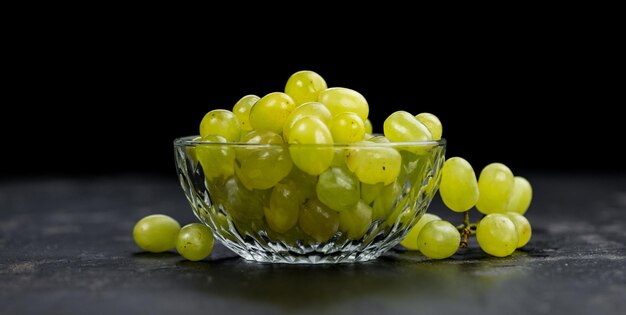 Slate slab with White Grapes selective focus closeup shot