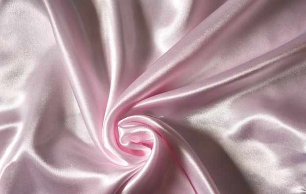 The sleek, elegant pink silk or satin texture can be used as a wedding backdrop. Luxury background design