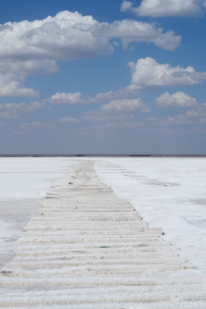 Sleepers in the salt crust on the salt lake in the village of Baskunchak in the Astrakhan region