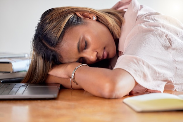 Sleeping employee and business woman burnout tired and fatigue while working on laptop in office Sleep girl and corporate employee workaholic struggling with workload problem and pressure