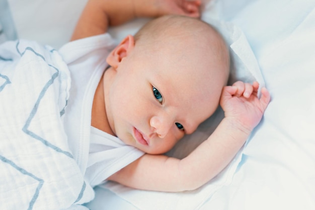 Sleeping newborn in the crib