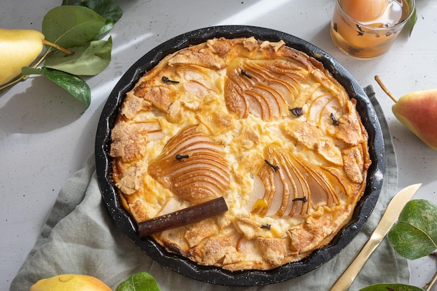 A slice of apple pie with a glass of beer on the side.