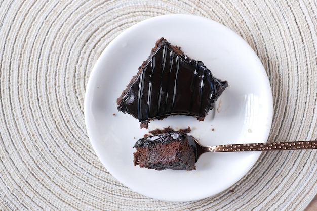 Slice of brownie on plate on table