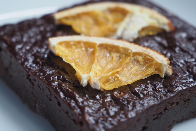 Slice of brownie on plate on table