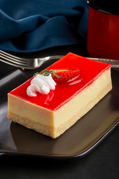 Slice of cheesecake with strawberry topping