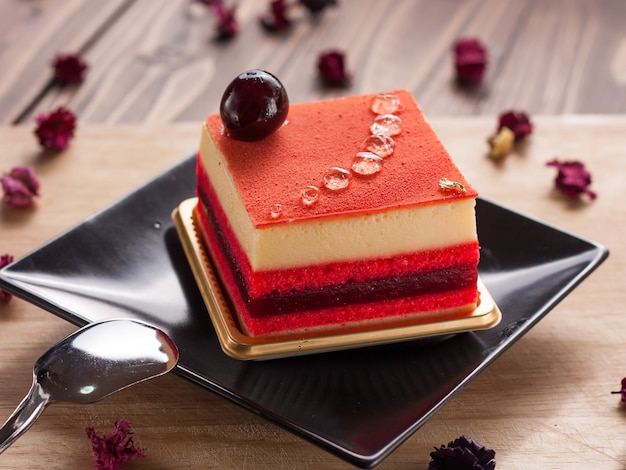 Slice of delicious berry mousse cake