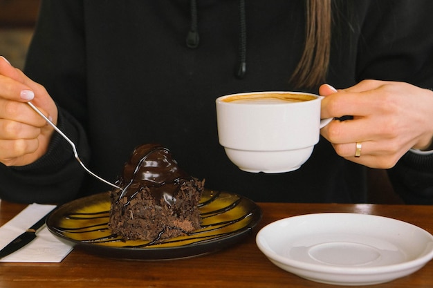 A slice of delicious cake and a cup of coffee