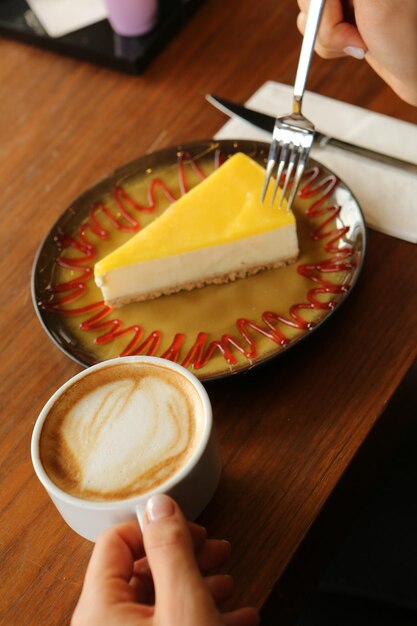 A slice of delicious cake and a cup of coffee