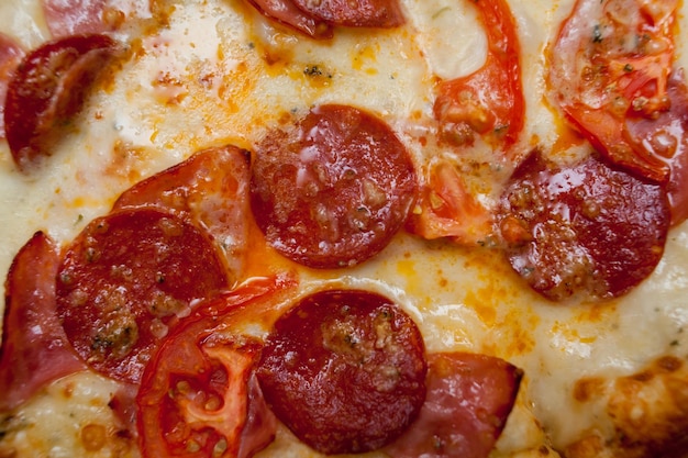 slice of delicious pizza with sausage pepperoni and cheese