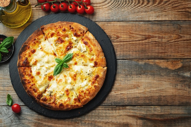 A slice of hot Italian pizza with stretching cheese Pizza four cheeses with basil