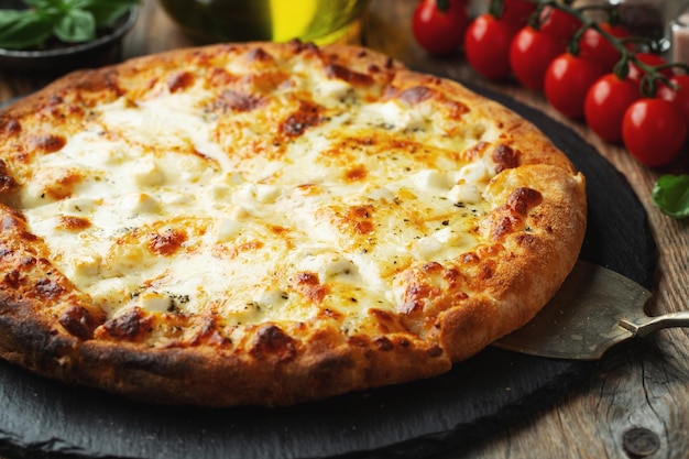 A slice of hot Italian pizza with stretching cheese Pizza four cheeses with basil