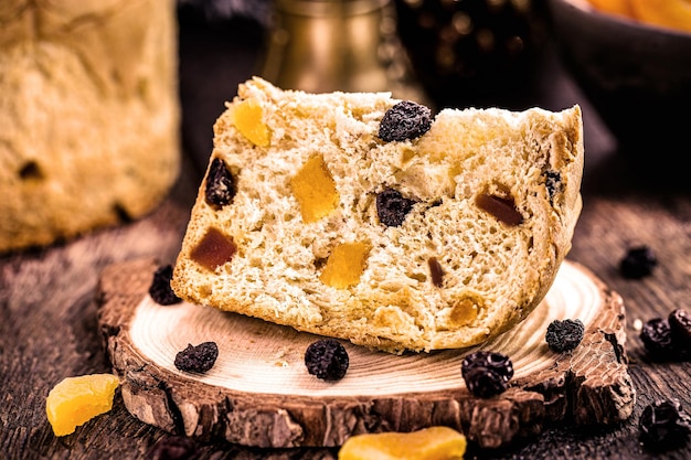 Slice of panettone, homemade baked bread with candied fruit, traditional for Christmas in Brazil and Italy.