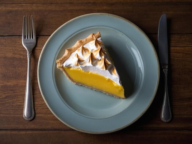 a slice of pie sits on a plate next to a fork and knife