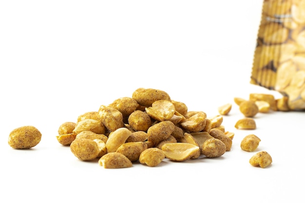 Slice of spicy nuts with pepper in close-up, snack for beer isolated on white background