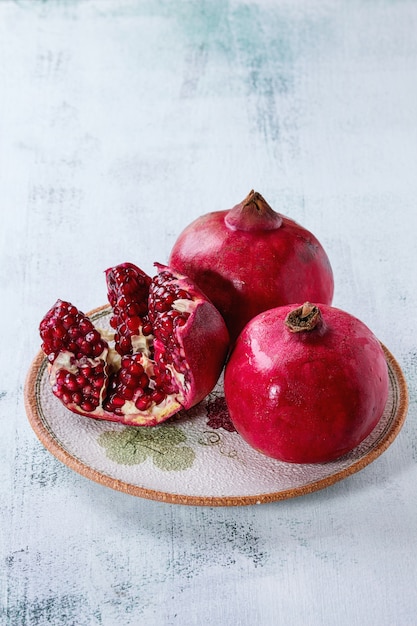 Slice and whole pomegranates