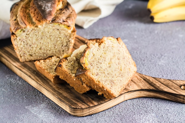 Sliced banana bread on a cutting board on the table Trendy dessert