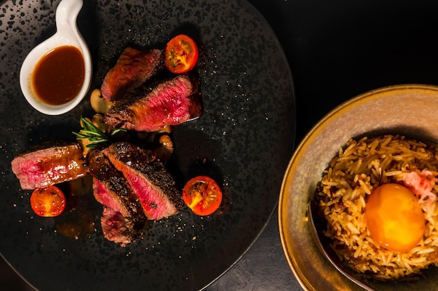 Sliced beef steak on black plateFood concept background