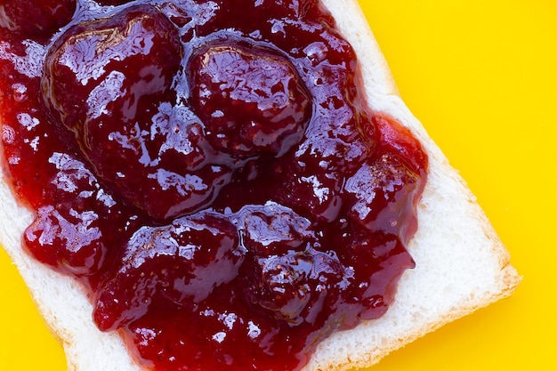 Sliced bread with strawberry jam