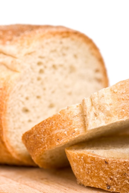 Sliced bread on wooden plate