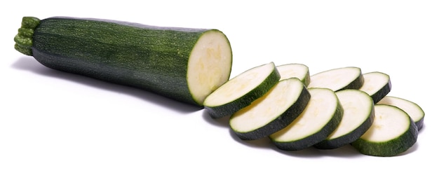 Sliced in circles green natural organic zucchini vegetable isolated on white background