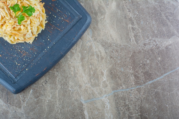 Sliced egg and rice on a tray, on the marble.