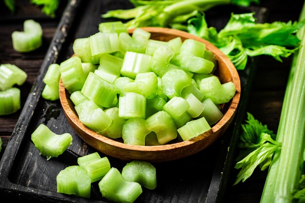 Sliced fresh celery On a dark wooden background