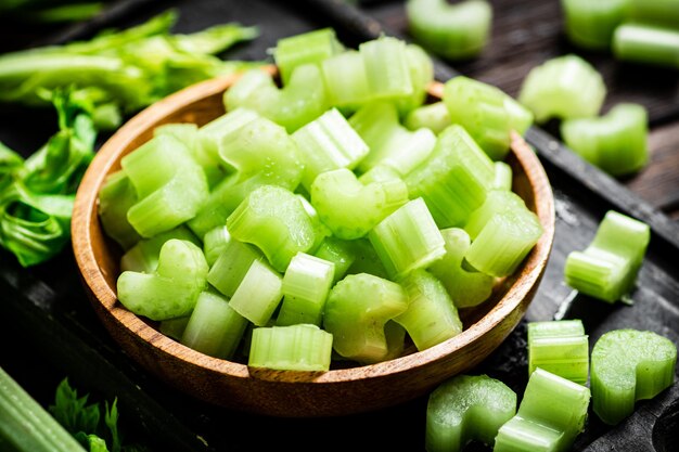 Sliced fresh celery On a dark wooden background