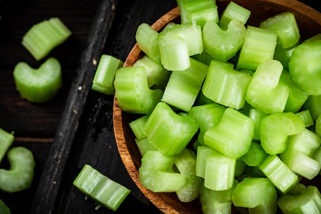 Sliced fresh celery On a dark wooden background