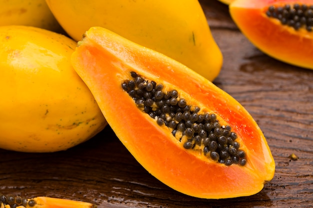 Sliced fresh papaya on wooden table