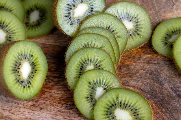 Sliced green kiwi on a cutting board