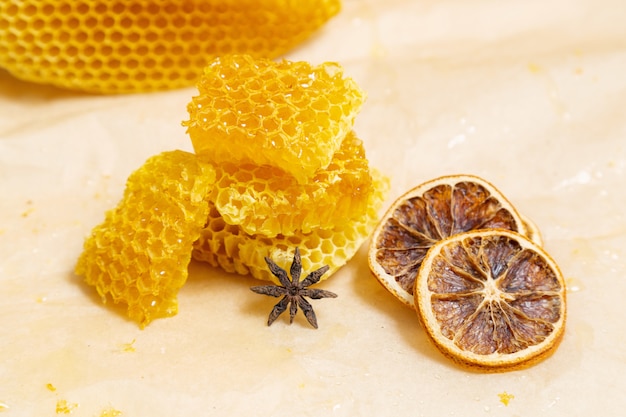 Sliced honeycombs lie on craft paper.