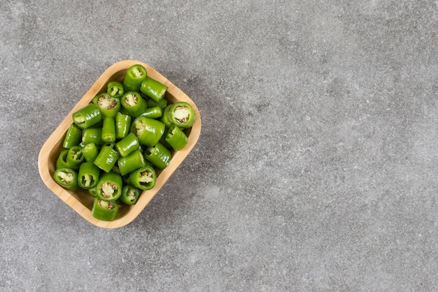 Sliced hot pepper in a bowl , on the marble.