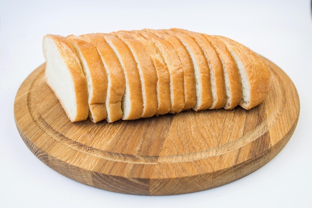 Sliced loaf of bread on a white background