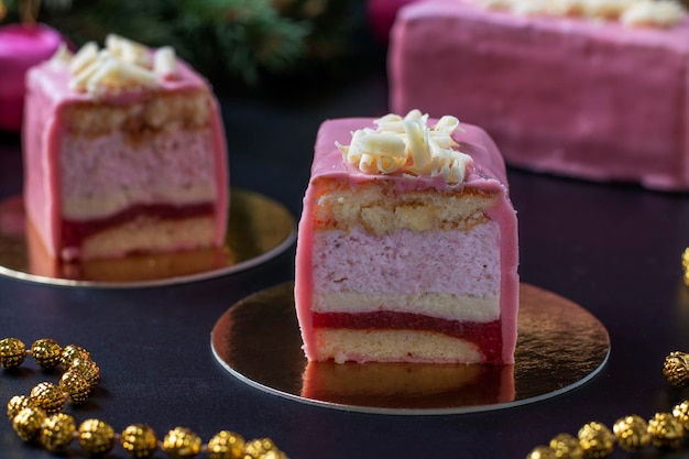 Sliced mousse desserts with almond biscuit strawberry coolie and strawberry mousse