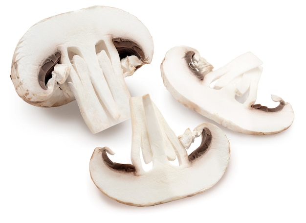 Sliced mushroom (champignon, cut foot, Agaricus Bisporus) and raw. Isolated on white background