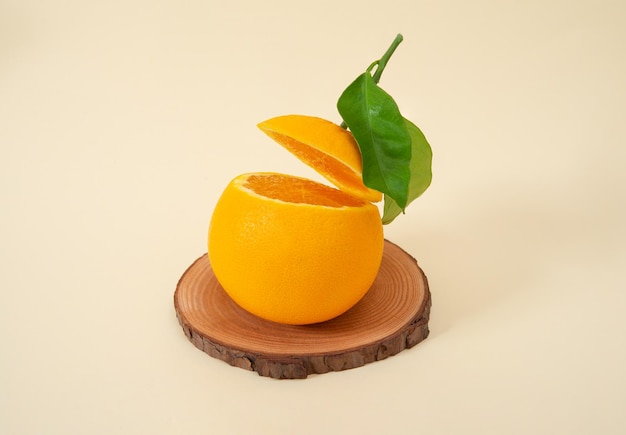 Sliced navel orange in acrobatic position colored gradient