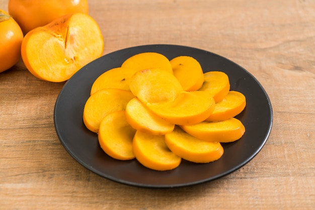 sliced persimmon on plate