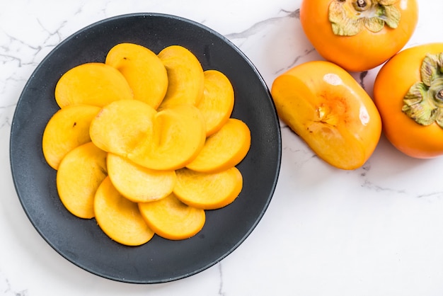 sliced persimmon on plate