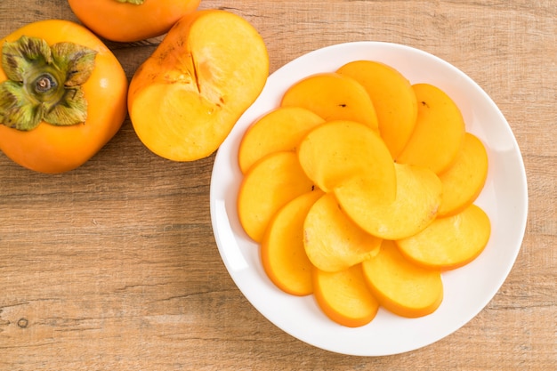 sliced persimmon on plate