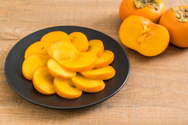 sliced persimmon on plate