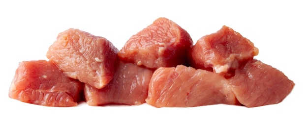 Sliced pieces of raw red meat ready for cooking on a white isolated background close-up