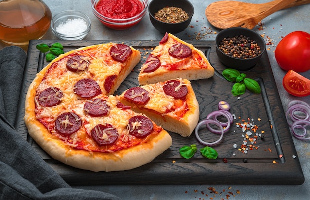 Sliced pizza on a cutting board