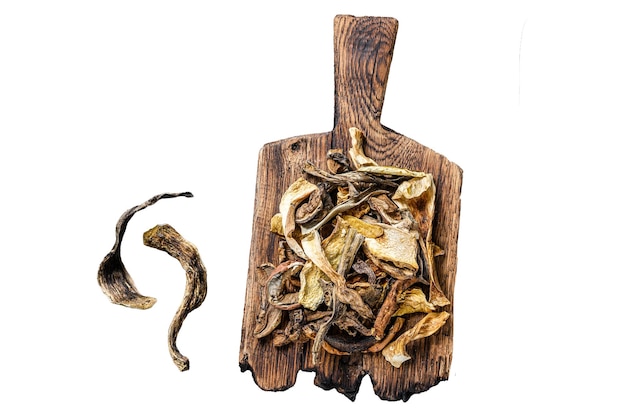 Sliced Porcini wild dried mushrooms on a wooden cutting board Isolated on white background top view