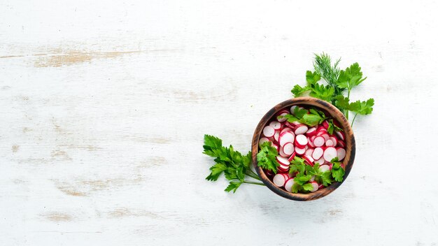 Sliced radishes on a Wooden Table Fresh vegetables Top view Free space for text