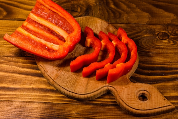 Sliced raw bulgarian pepper on cutting board