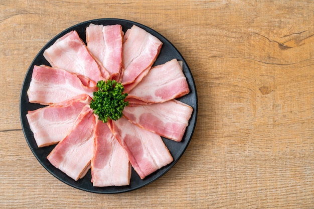 sliced raw pork bacon